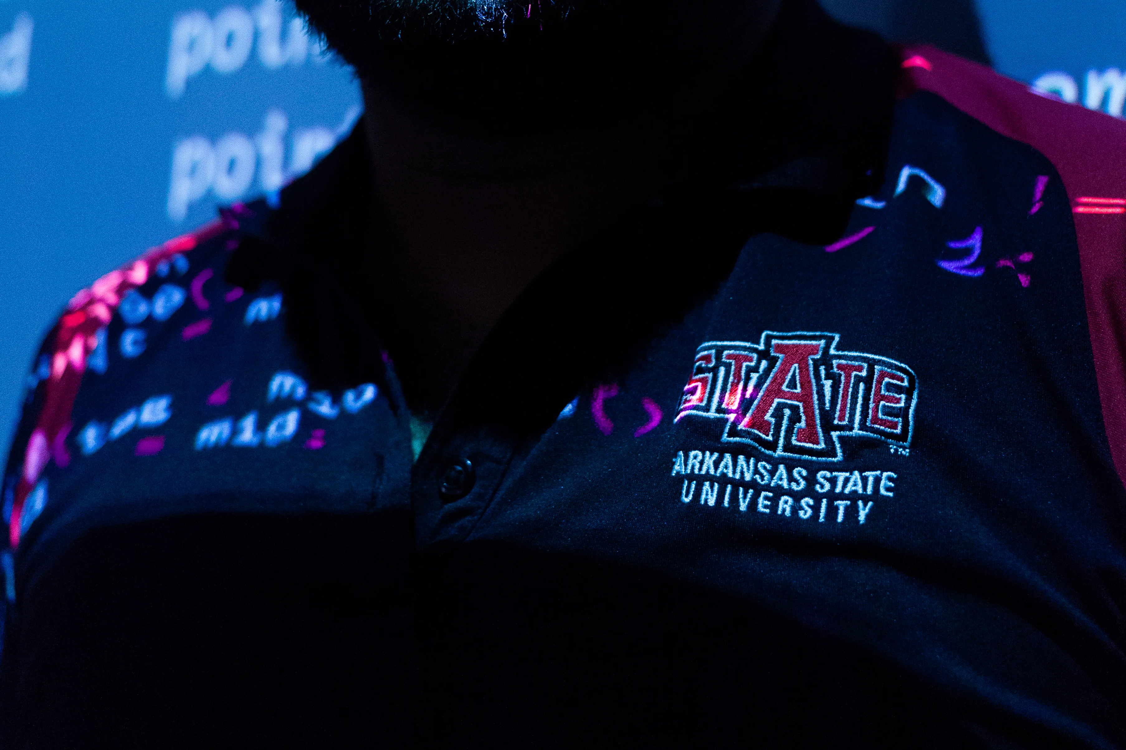 coding sceren being projected onto an a-state shirt.