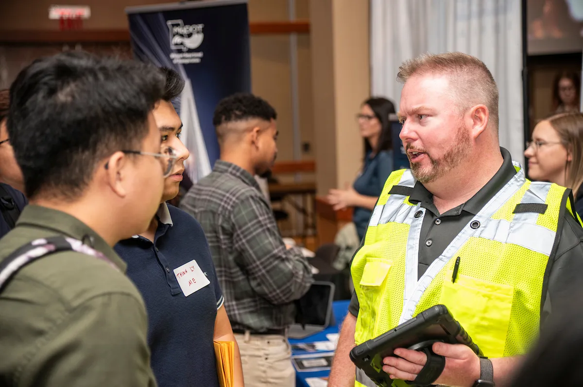 A-State students are questioned by a career fair industry rep.