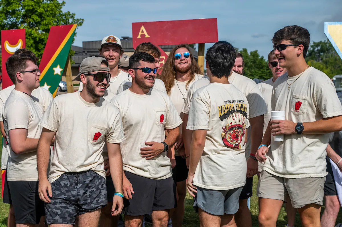 Fraternity members hang out in front of the student union.