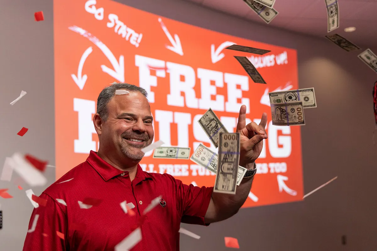 Chancellor Todd Shields unveils a new scholarship at the A-State Welcome Center