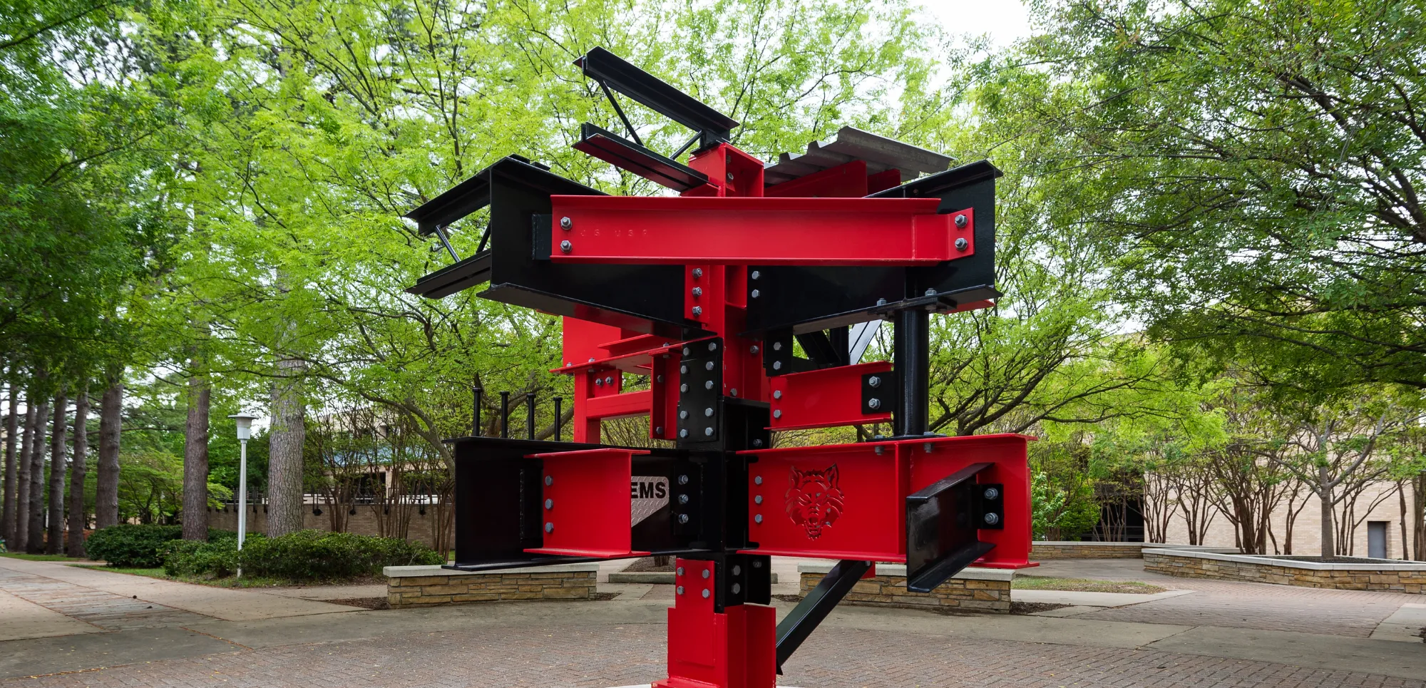A-State engineering statue outside of campus by the lab building.