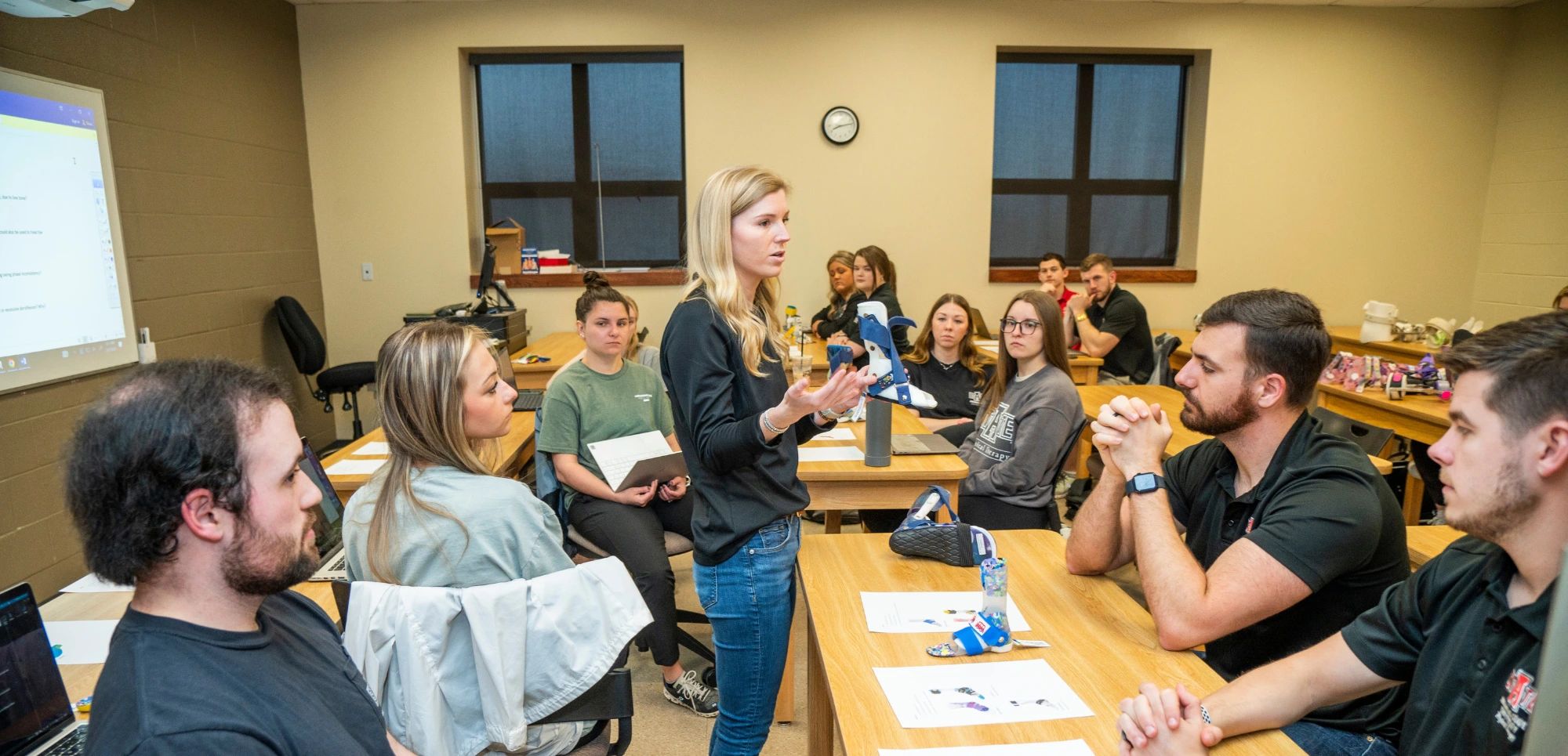 Dr. Rachel Wilkins teaching DPT students in the classroom.