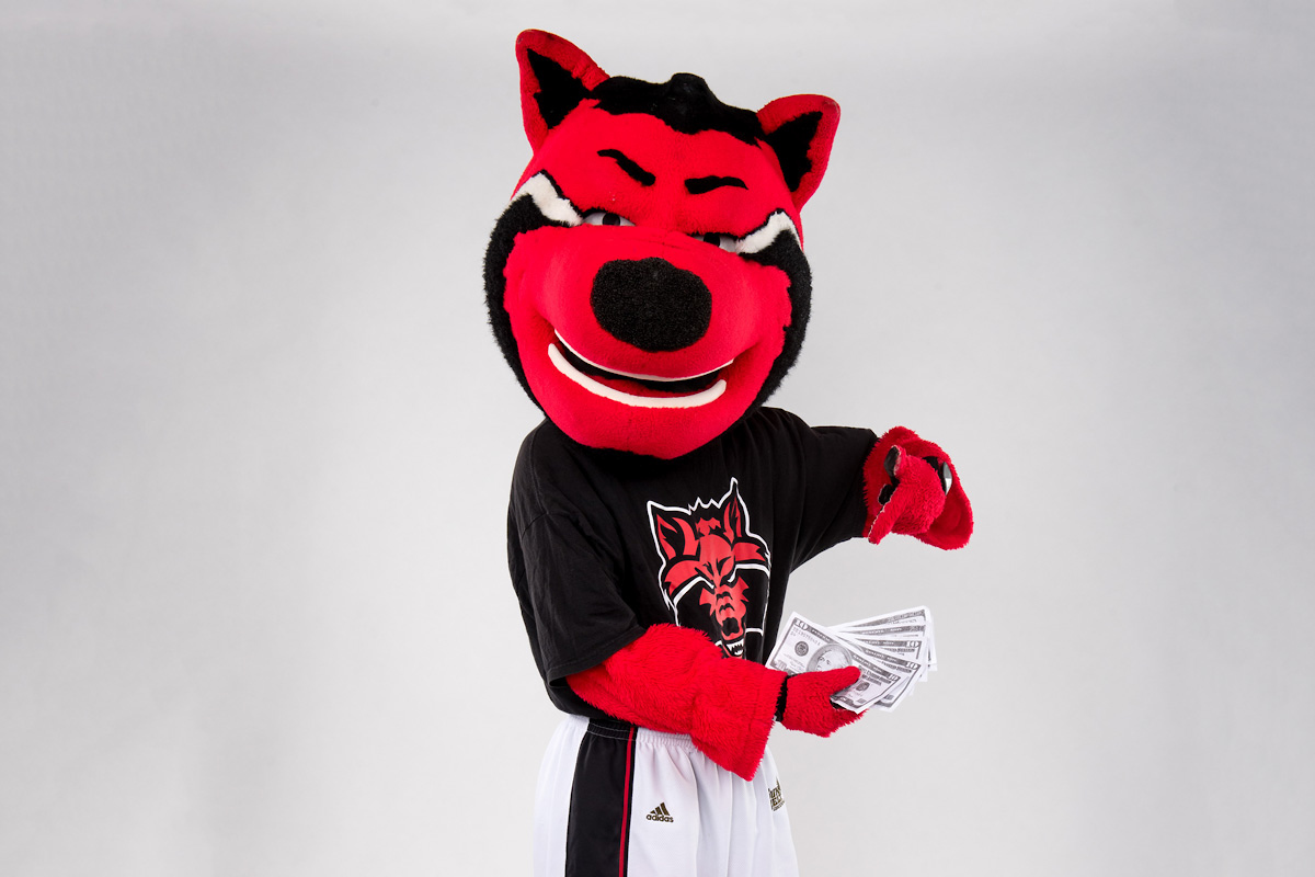 Howl, A-State’s Mascot, holding a wad of cash in his hands.
