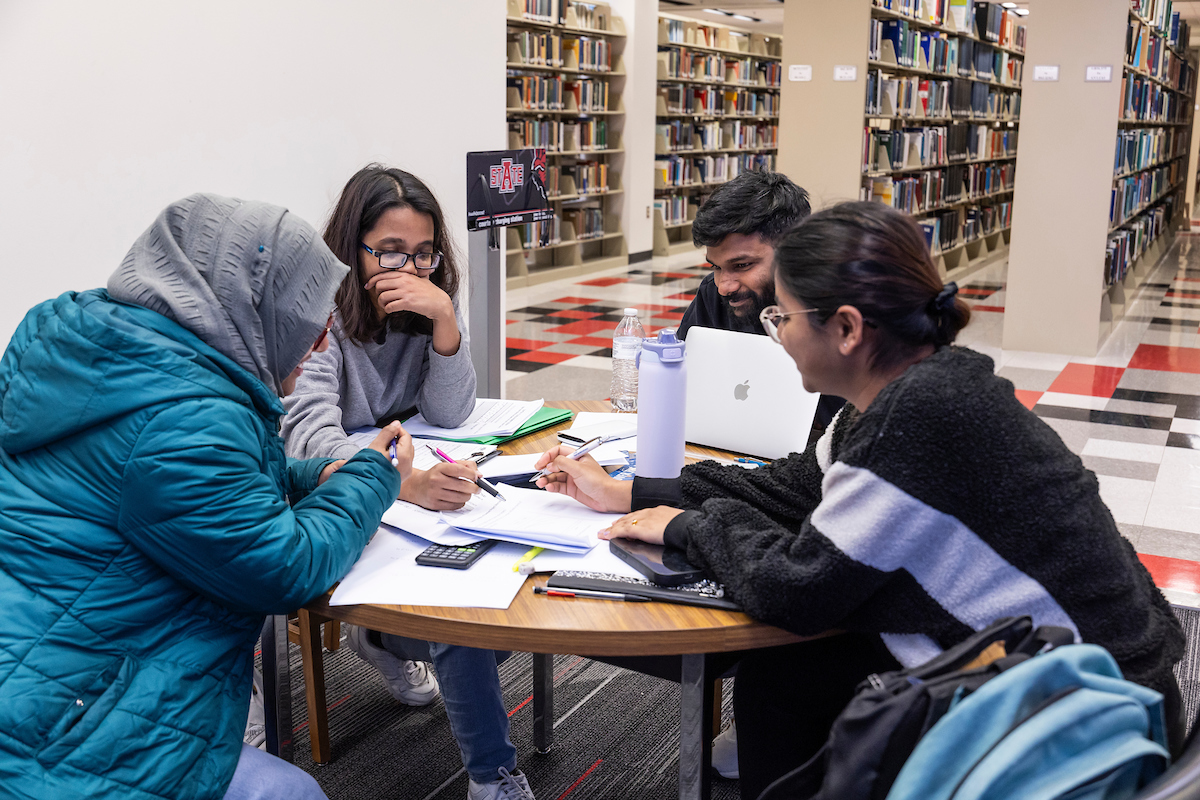 International student group studying in Dean B. Ellis Library