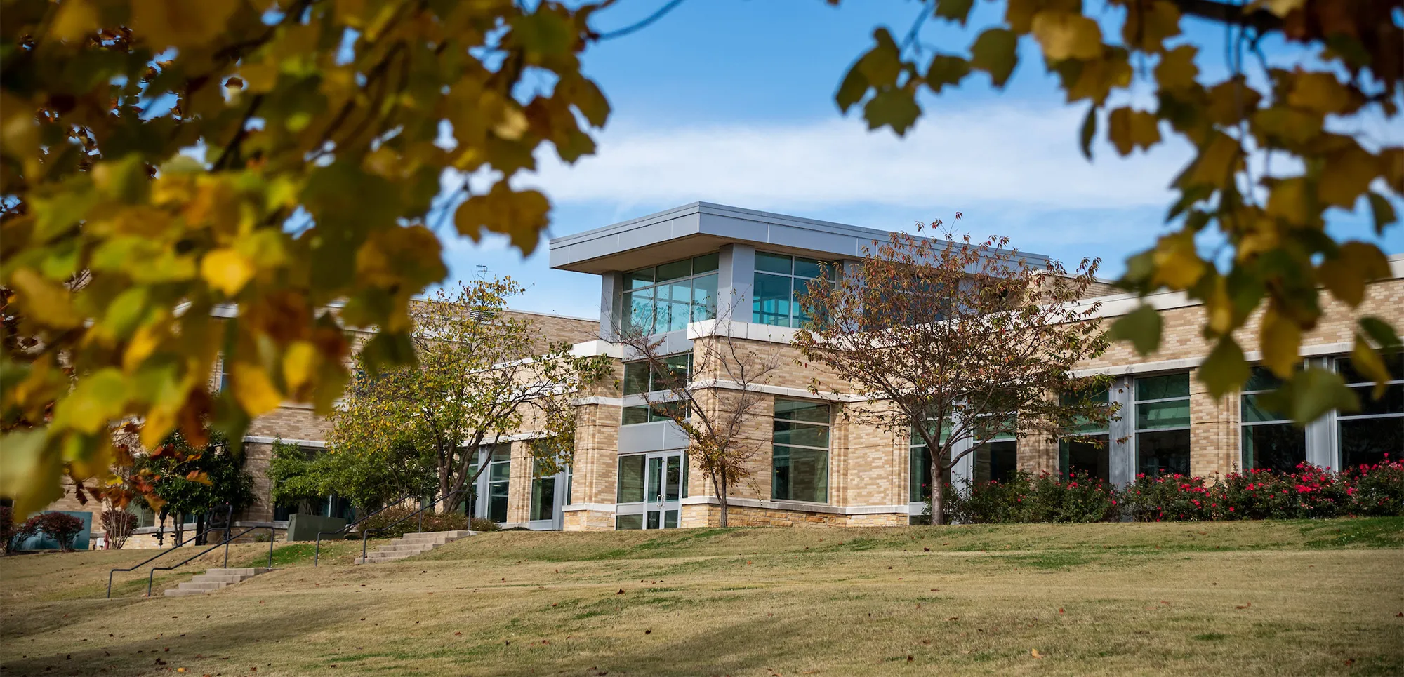the east end of the Reng Student Union with fall foliage