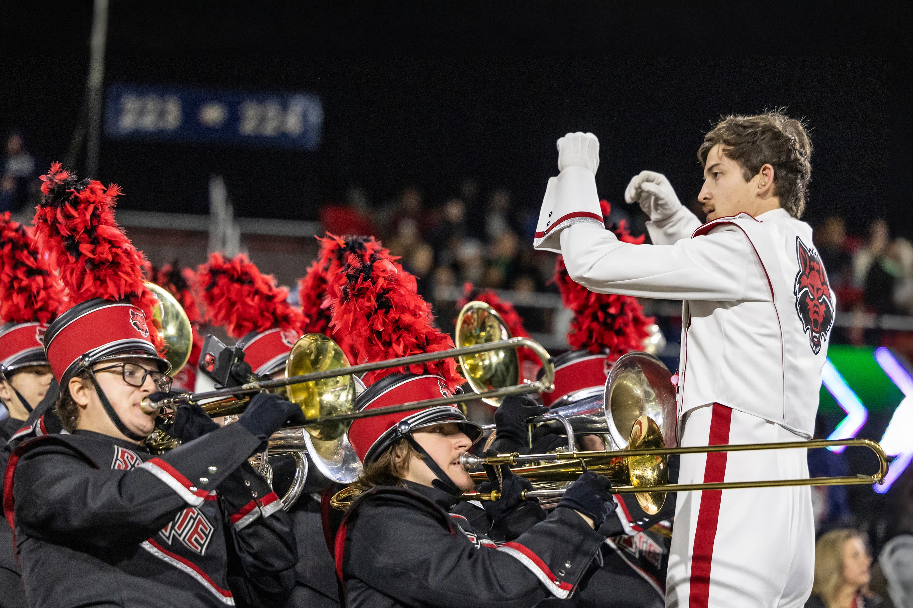 A conductor directing an orchestra.