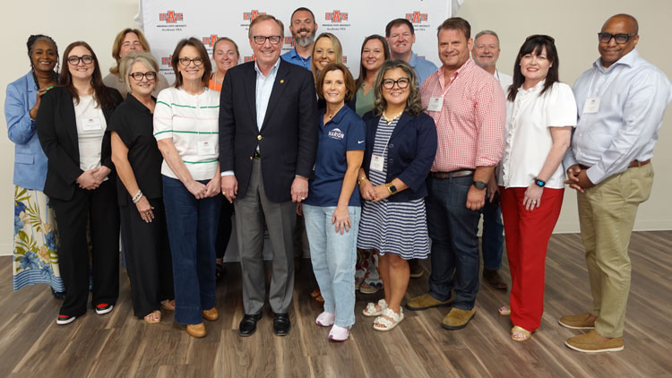 Group of people standing for a photo.