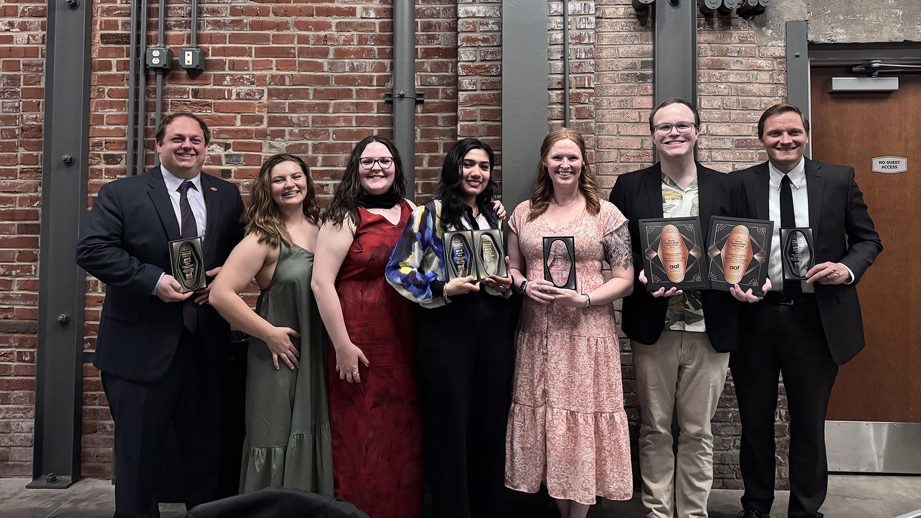 Staff member at awards event.