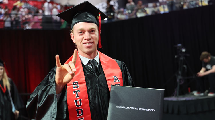 A-State graduate during the commencement exercise. &nbsp;