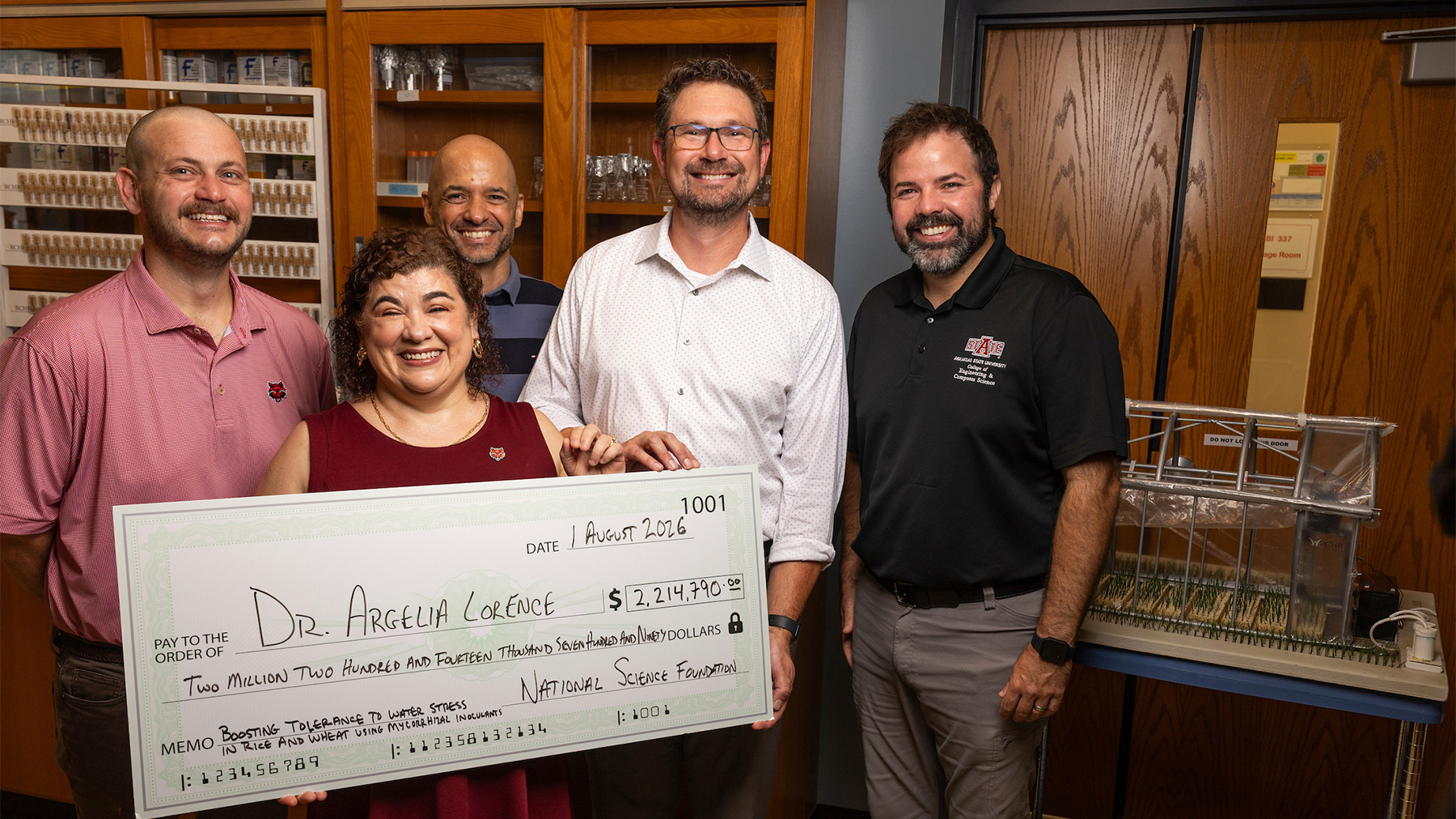Researchers with big check from NSF