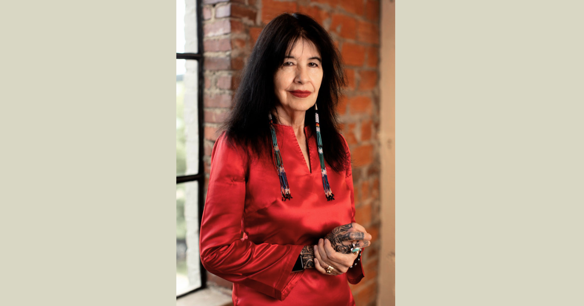 Photo of a woman in a red shirt.