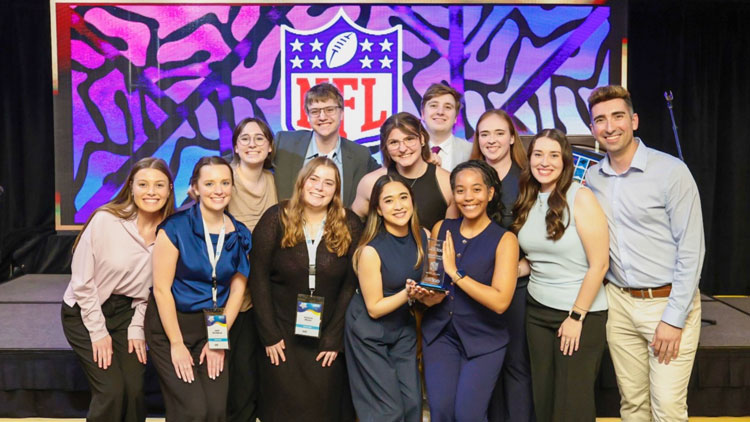 Professor Leslie Parker's graphic design class at NSAC holding the Jeanie Ruedy Spirit Award.