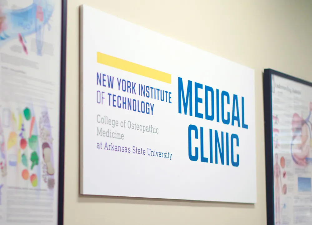 NYITCOM Medical Clinic sign on a wall