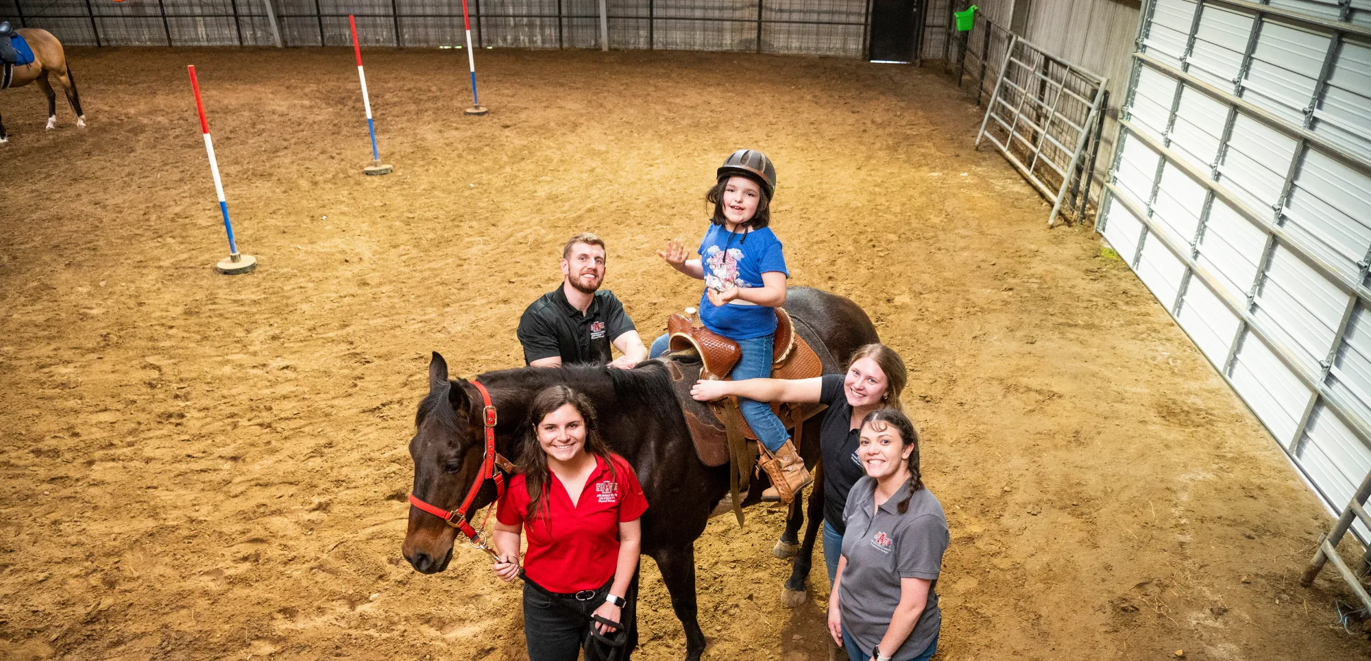 Physical Therapy student at A-State doing tests on another student.
