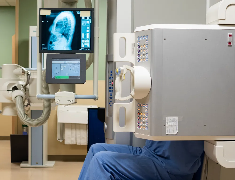 A-State radiology professor showing a student how to read an image.
