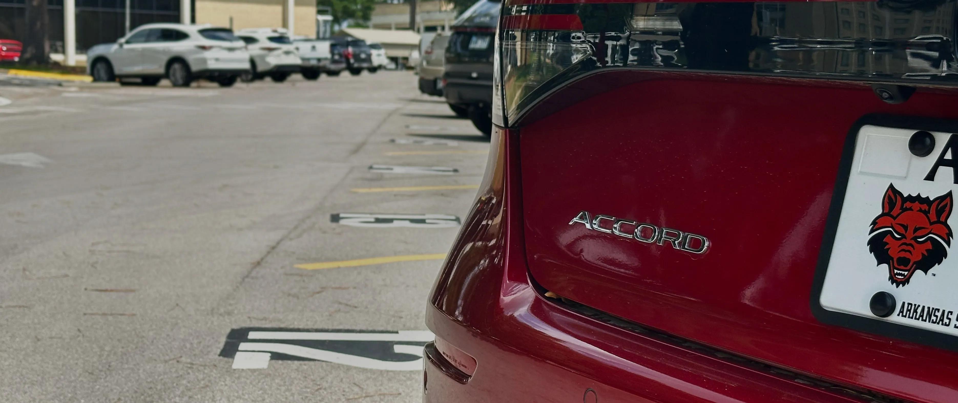 red Honda Accord in a parking lot