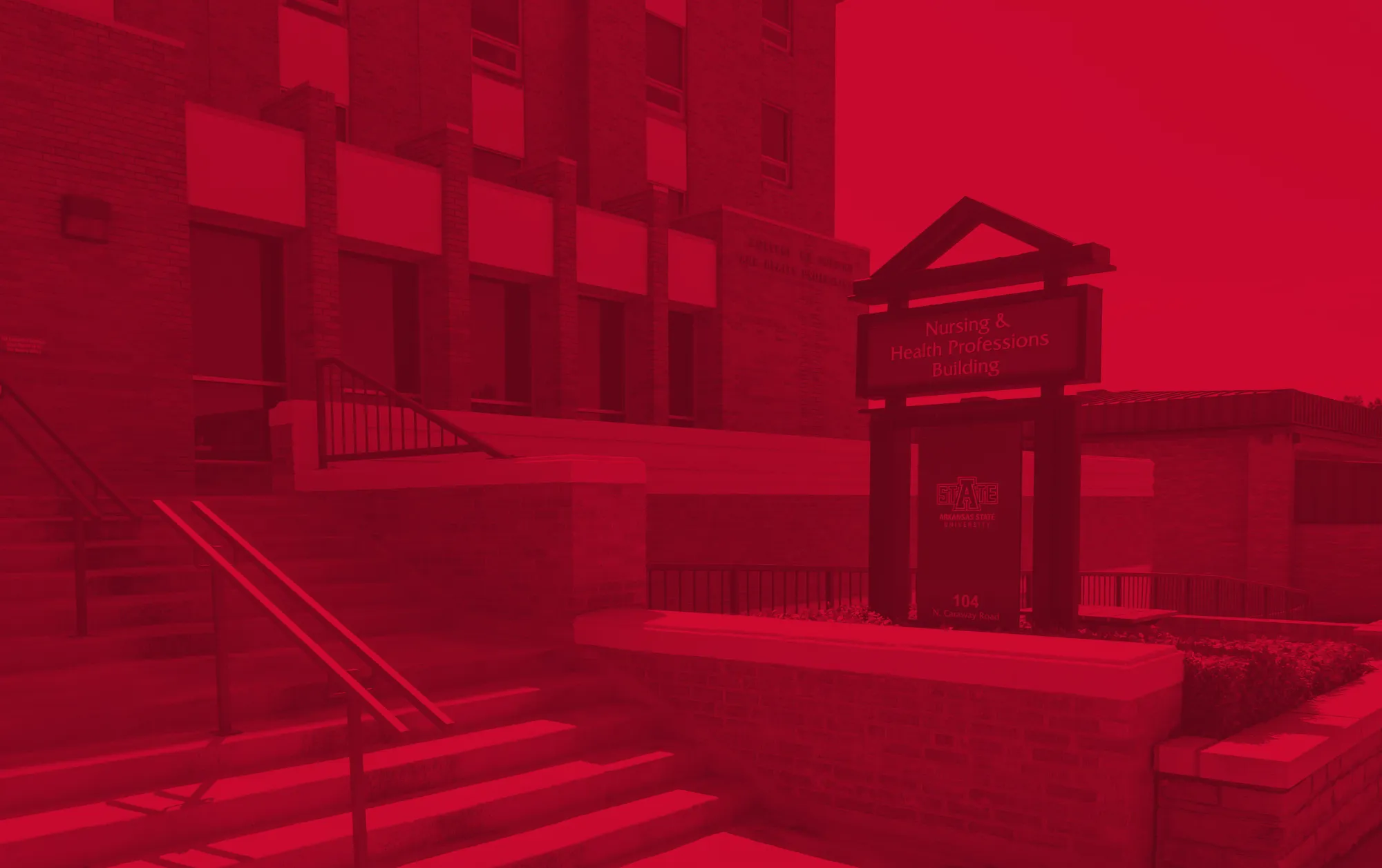Nursing and Health Professions building on a sunny day with a red filter applied.