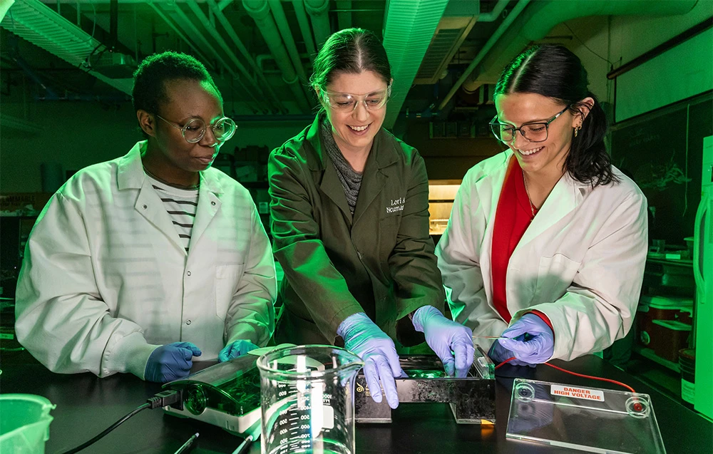 students and instructor working in a lab
