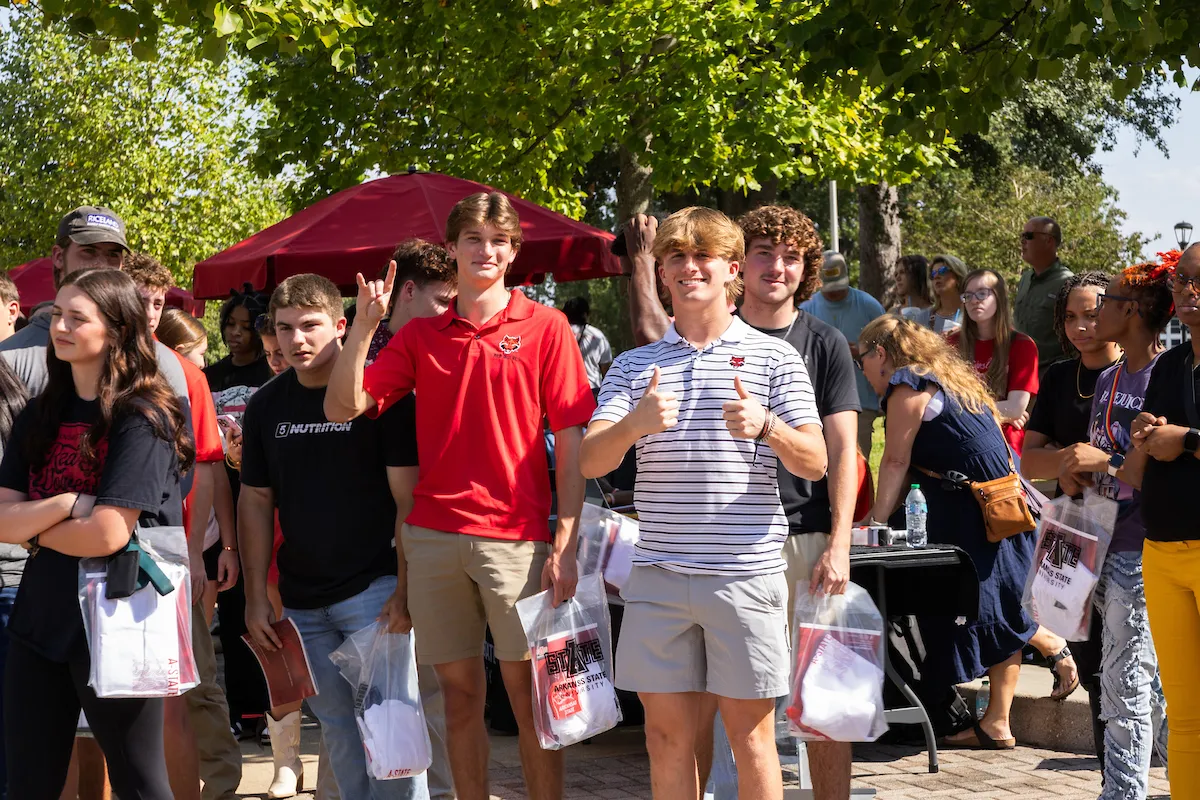 A group of high school students gather for a campus tour at A-State