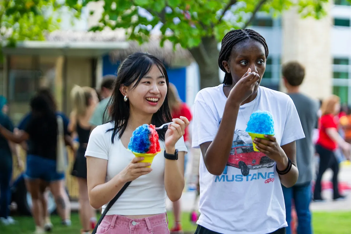 Students enjoy a snow cone at a SpringFest campus event.