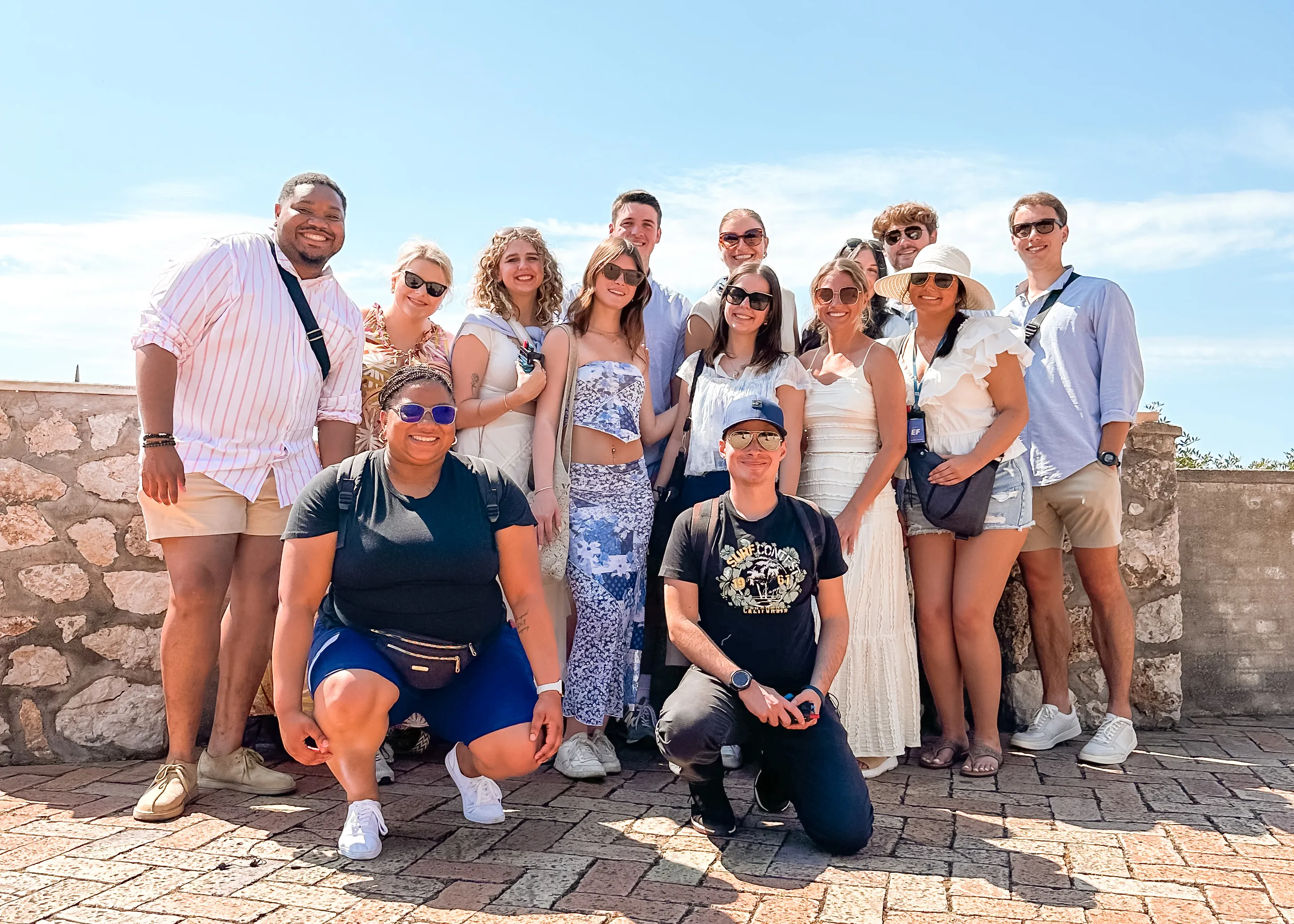 A group of students smiles together during a study abroad trip.