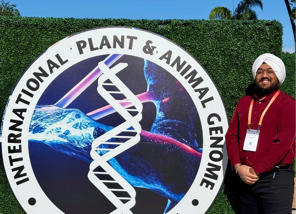 Student presenting graduate research at an event out of state.