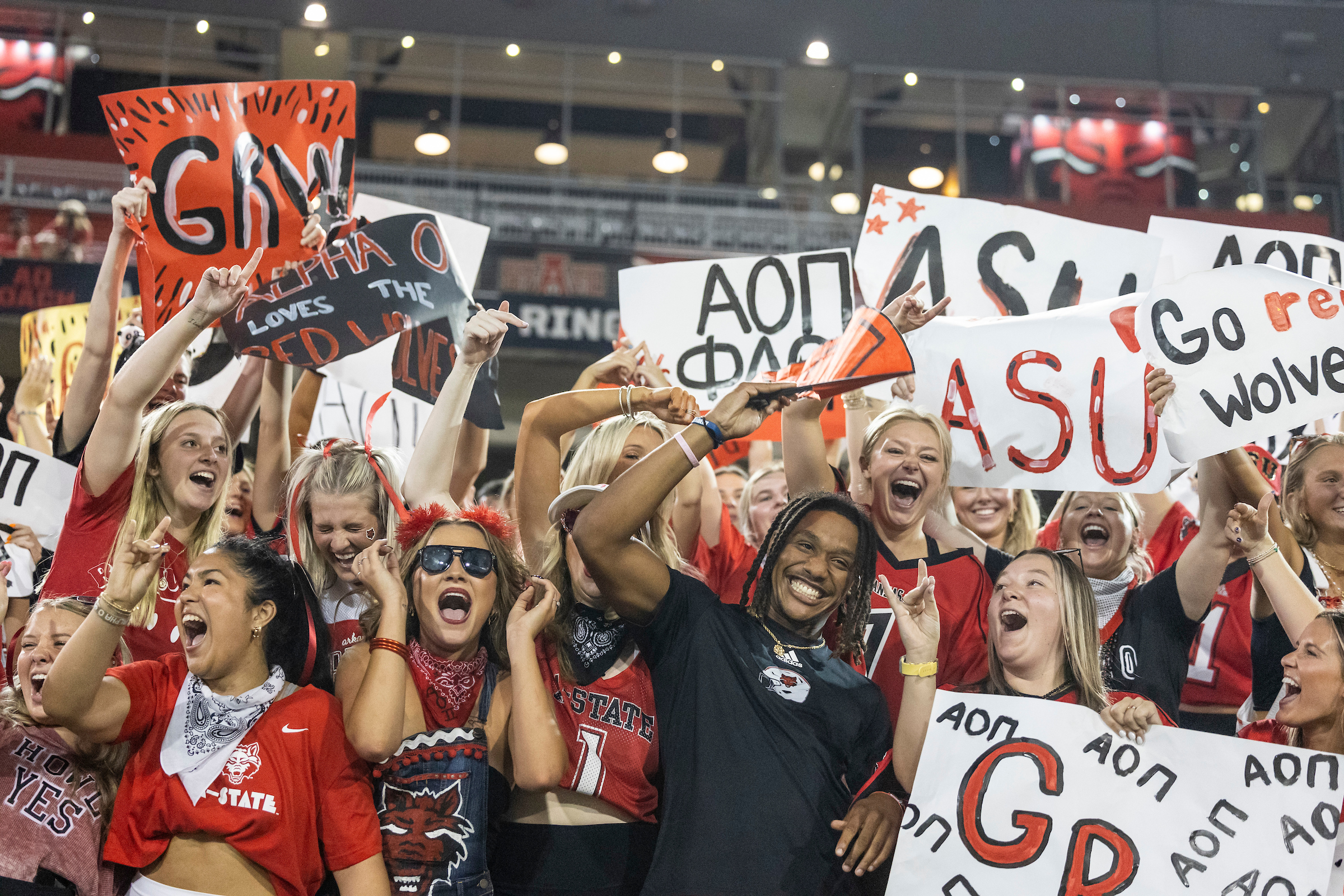 Red Wolves fans cheering at a game.